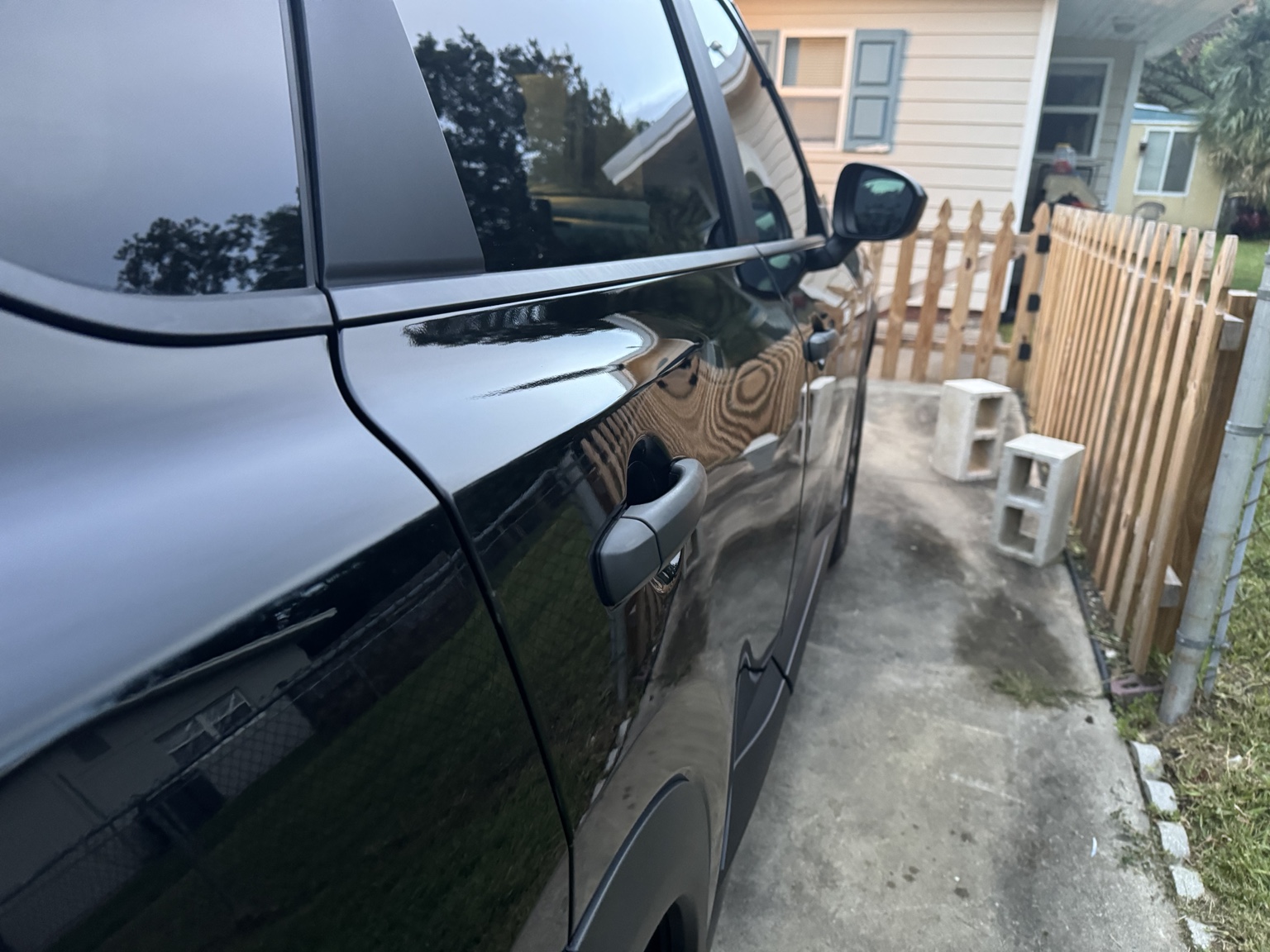 Freshly detailed vehicle and clean driveway in Jacksonville, Florida
